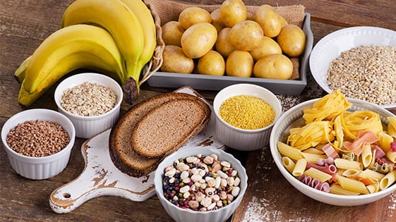High carb foods on wooden table
