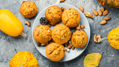 Pumpkin muffins on plate ready to be eaten as a Fall snack.  Pumpkin muffins on plate ready to be eaten as a Fall snack.