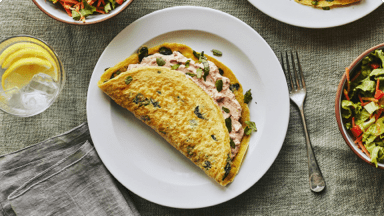 Spinach and sundried tomato stuffed crepe omelette ready to be eaten.  Spinach and sundried tomato stuffed crepe omelette ready to be eaten.