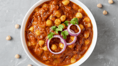 Savoury chana masala in a bowl ready for dinner. Savoury chana masala in a bowl ready for dinner.