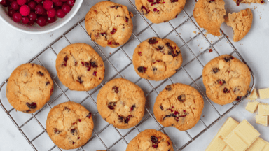Oatmeal chocolate cranberry cookies cooling on a wire rack.  Oatmeal chocolate cranberry cookies cooling on a wire rack.